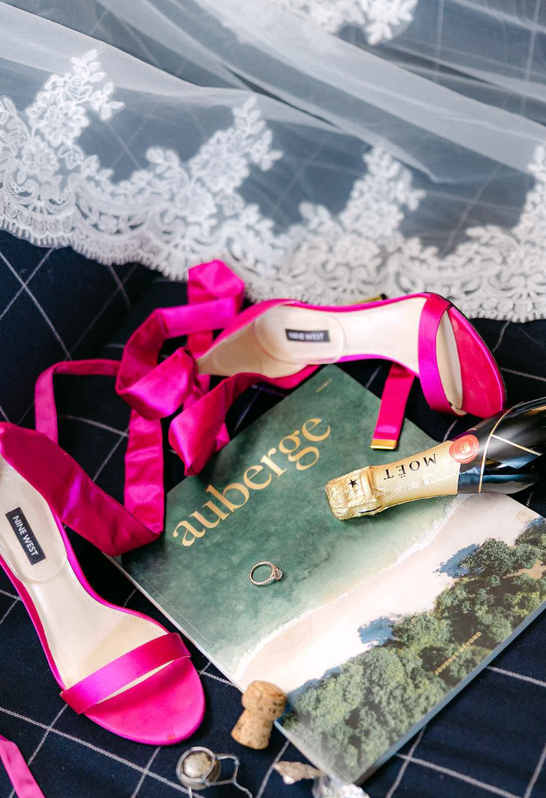 Estate wedding flat lay with rings, stationery, flowers, and details photographed by a Boston wedding photographer