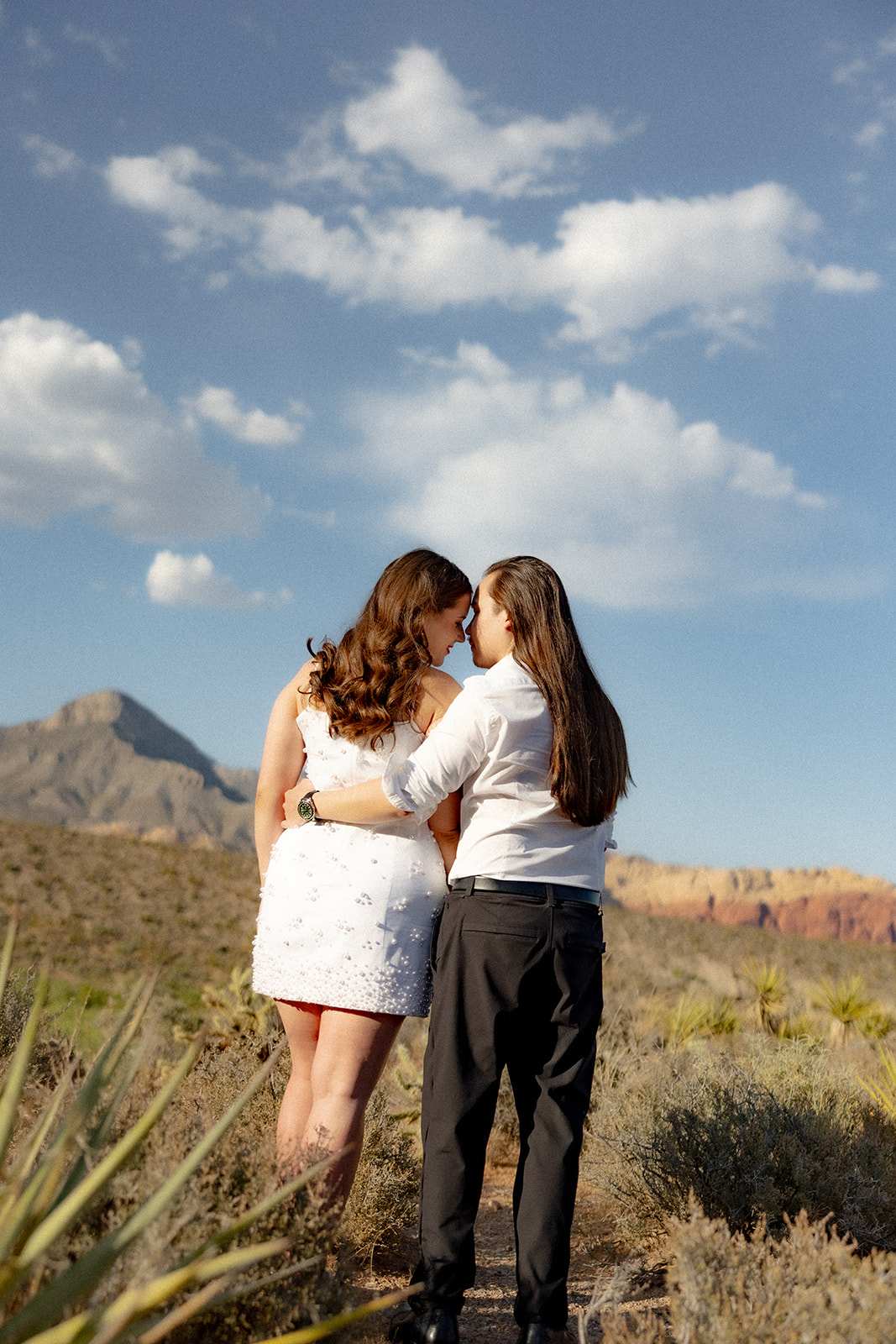 Couple captured in a candid moment during their engagement session, avoiding overly posed shots.