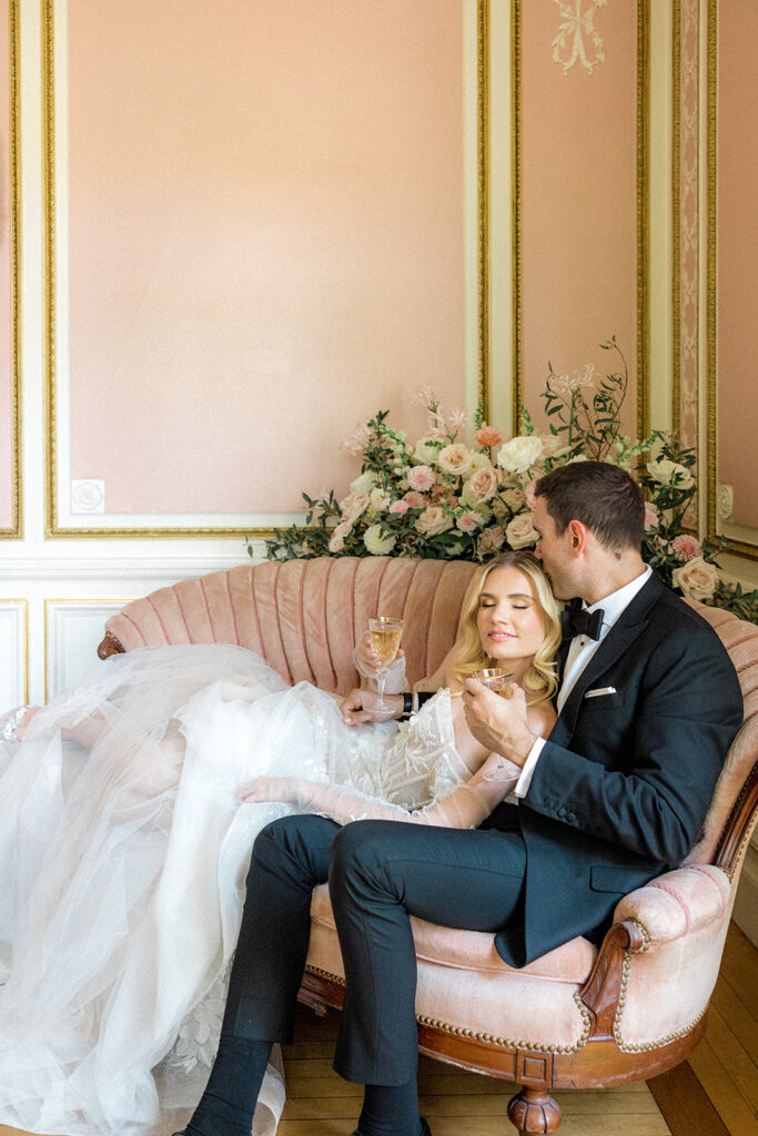 bride and groom drinking champagne