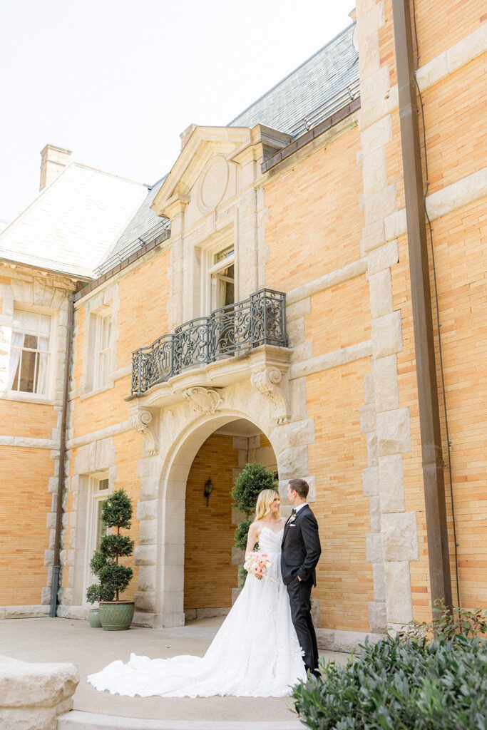 bride and groom looking at each other 