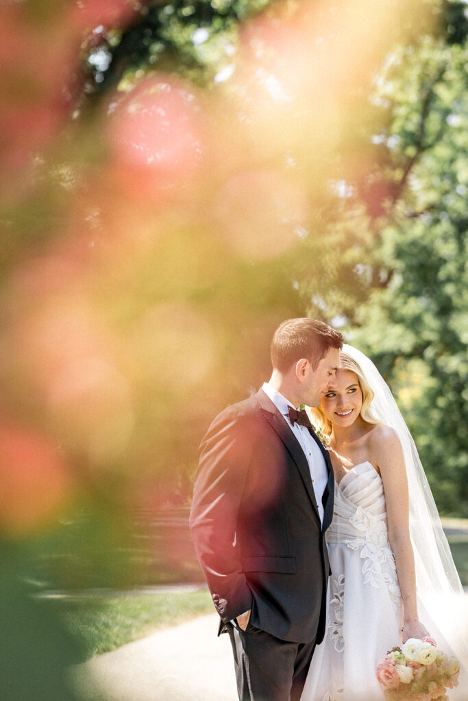 groom kissing the bride on the forehead 