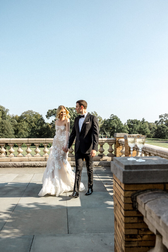 bride and groom walking around their wedding venue 