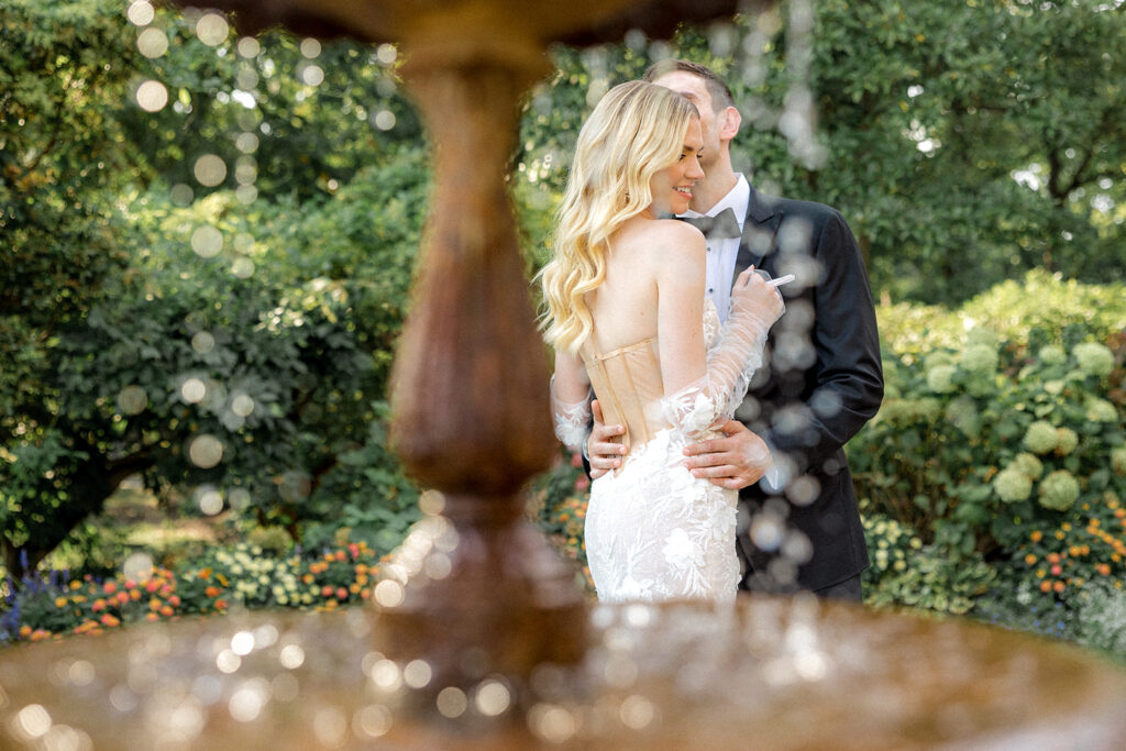 groom kissing the bride on the cheek at their elegant wedding