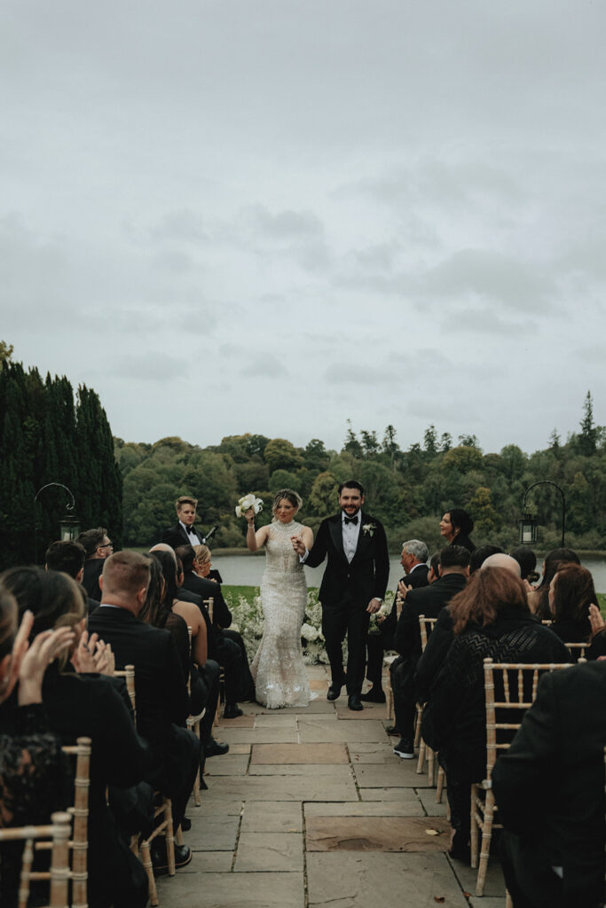 bride and groom heading to their reception