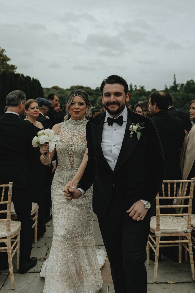 happy newly married couple holding hands