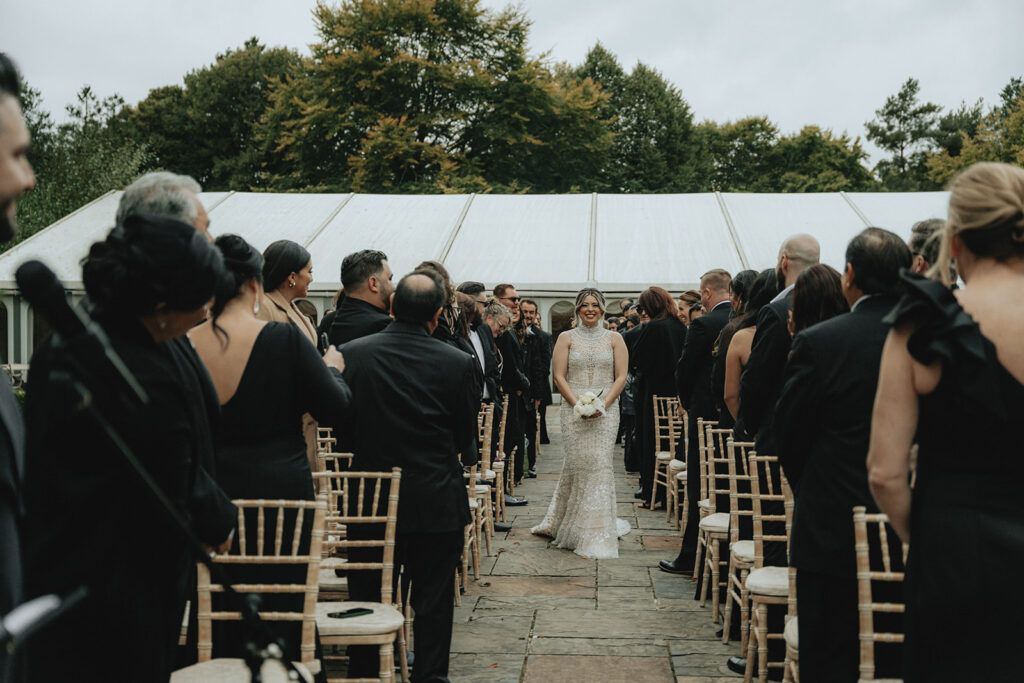 stunning bride walking down the aisle 