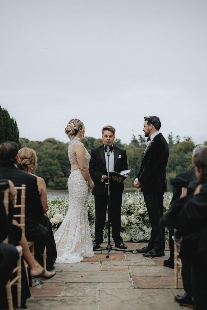 couple holding hands during their wedding ceremony