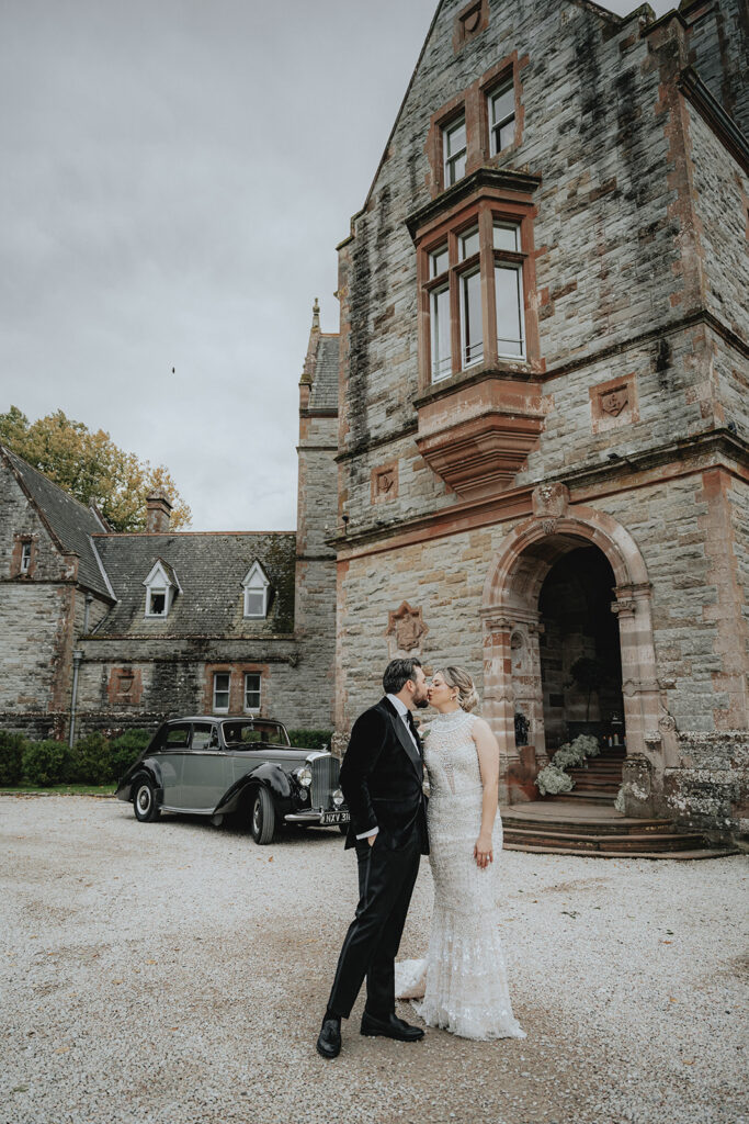 cute couple kissing before heading to their ceremony