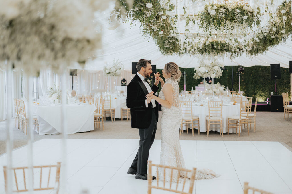 cute newly married couple dancing 