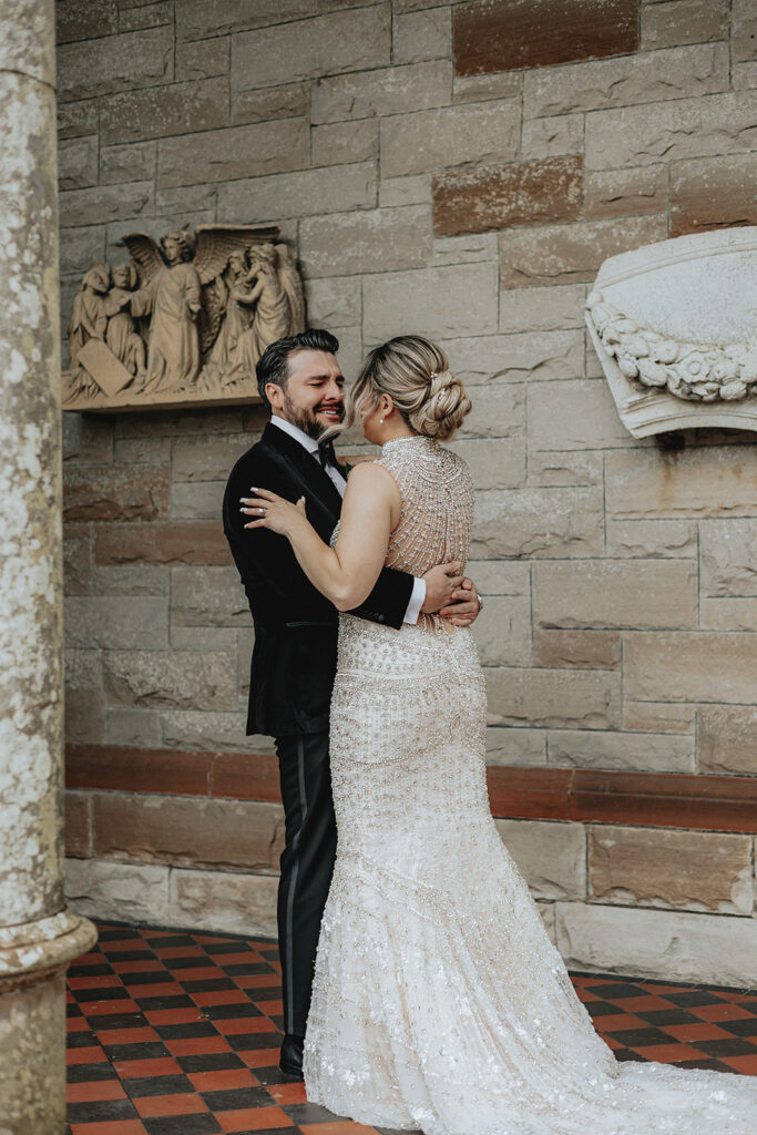 bride and groom hugging after their first look