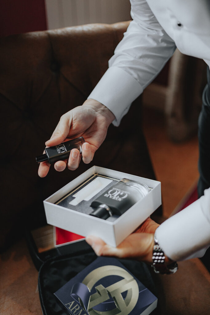 groom opening his wedding gift