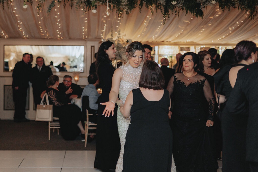 bride and her guests dancing 