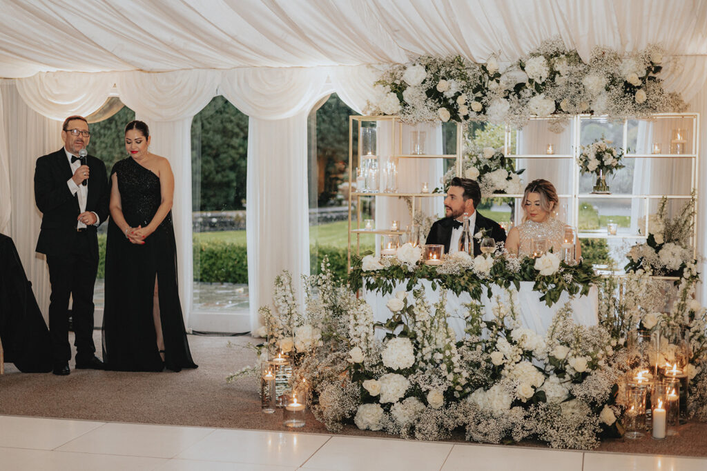 bride and groom during their reception speeches