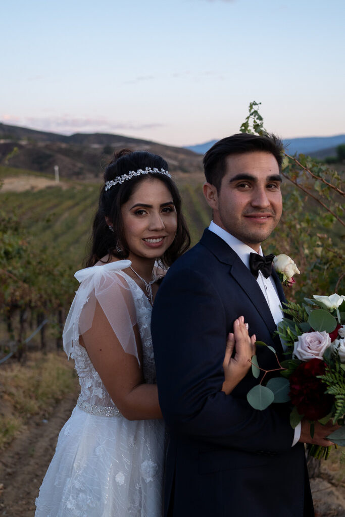 newly married couple posing for the camera