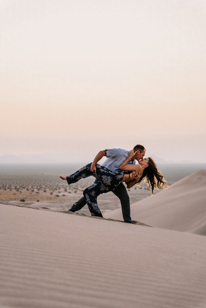 cute couple kissing during their engagement photoshoot