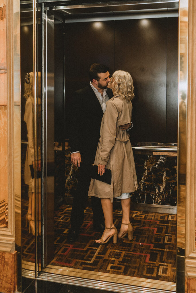 cute picture of the newly engaged couple in an elevator 