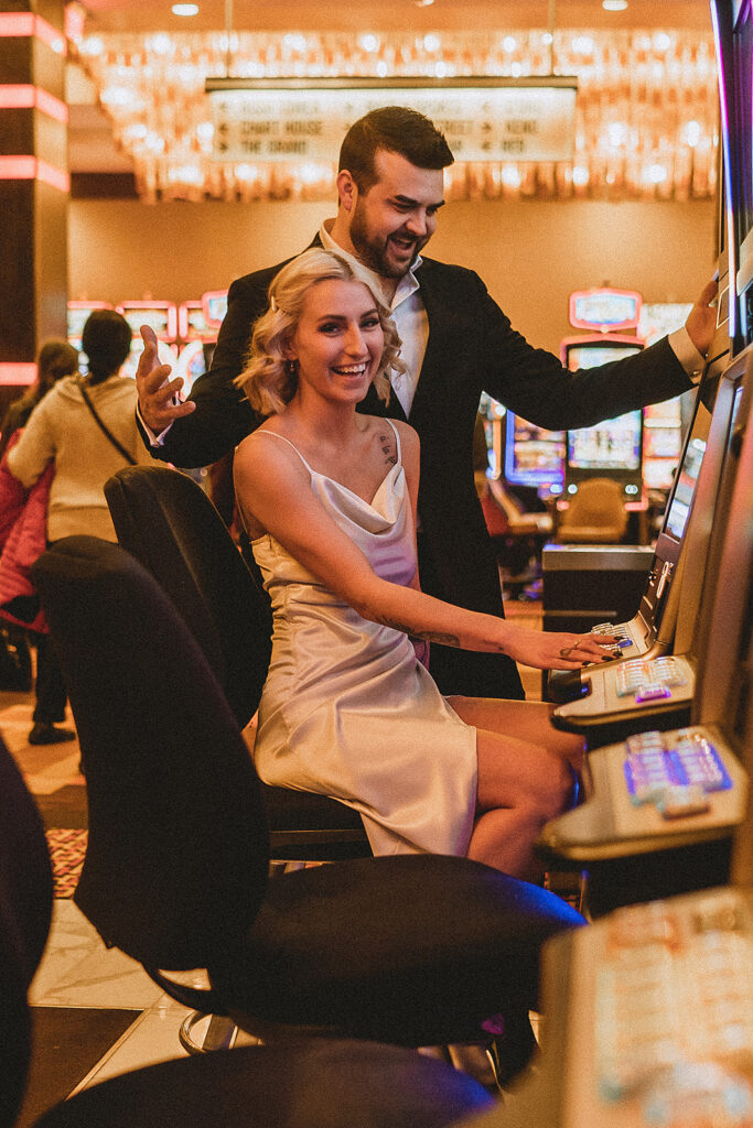 couple playing during their las vegas engagement photoshoot