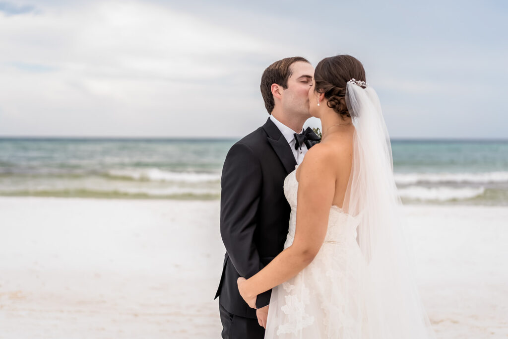 portrait of the newlyweds kissing