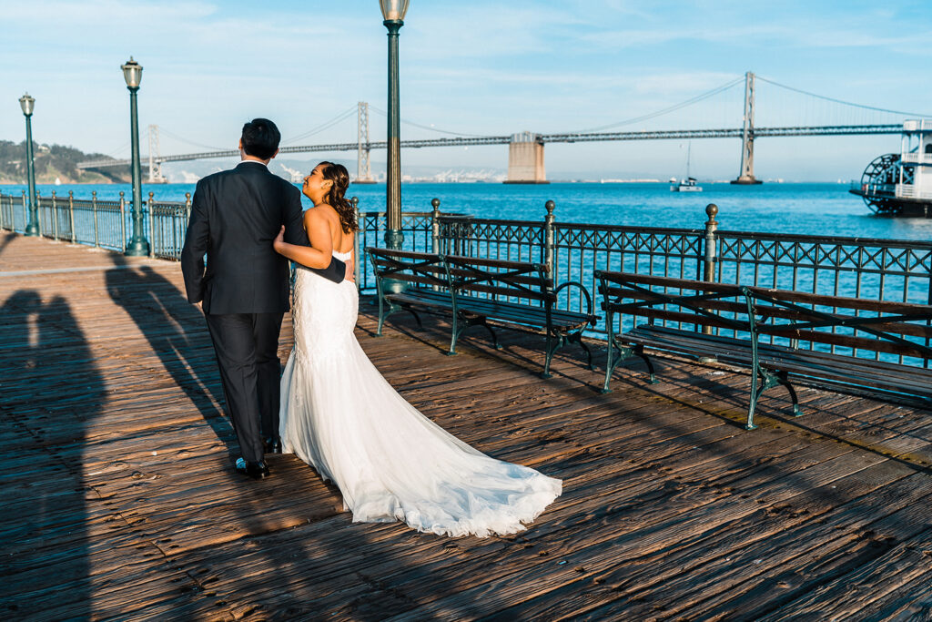 cute couple walking around the pier