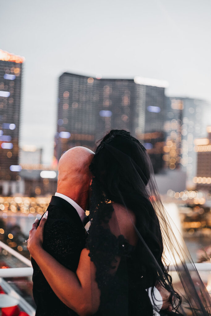 picture of the bride and groom hugging 