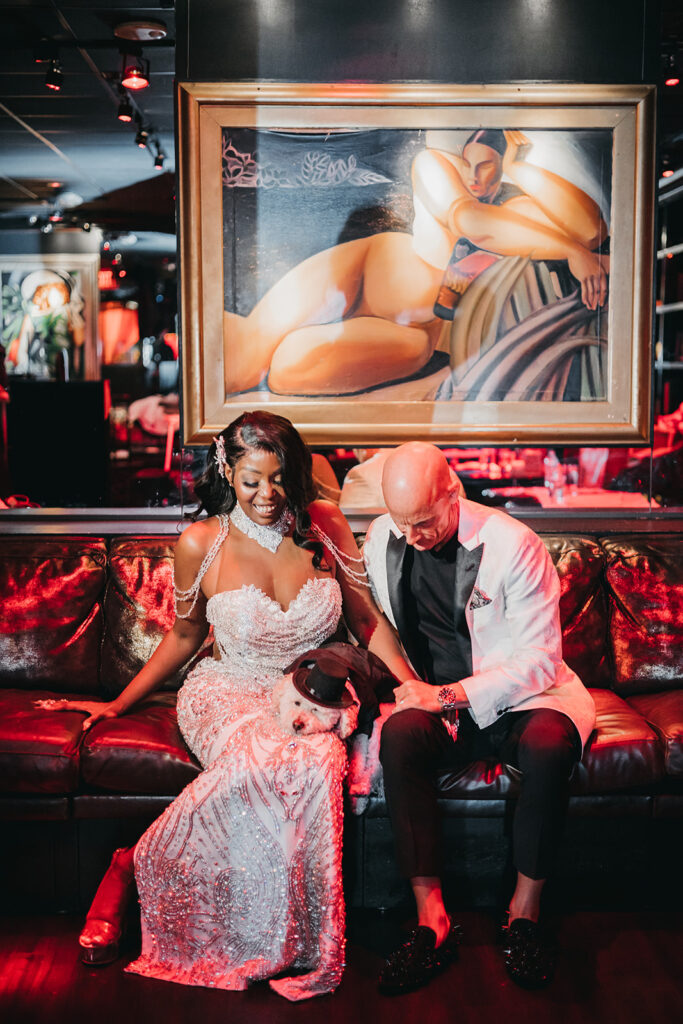 cute picture of the bride and groom with their dog at their chic las vegas wedding 