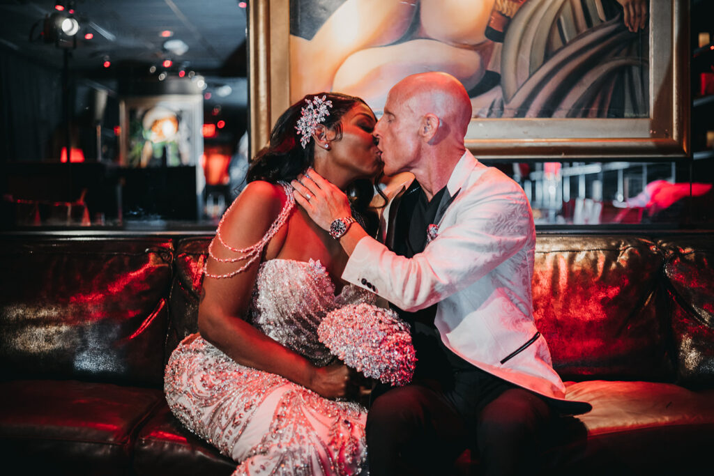 picture of the newlyweds kissing at their chic las vegas wedding reception