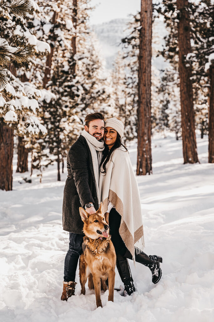 cute couple posing for the camera during their winter engagement session