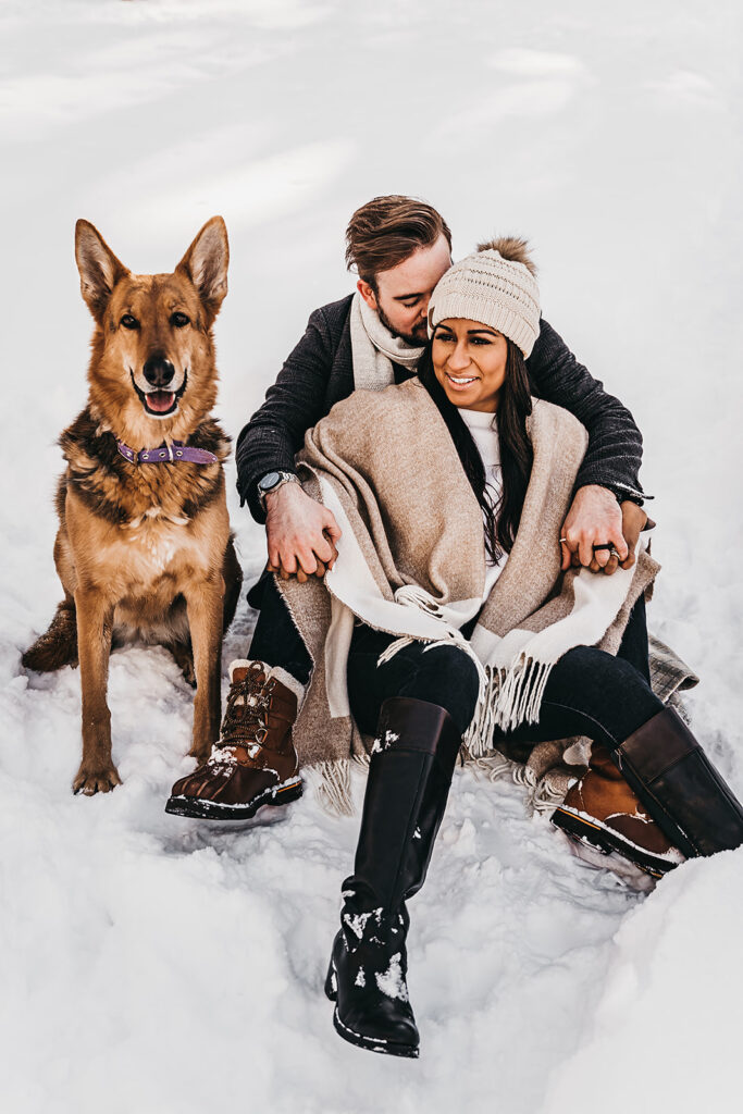 fiance kissing his fiance on the cheek