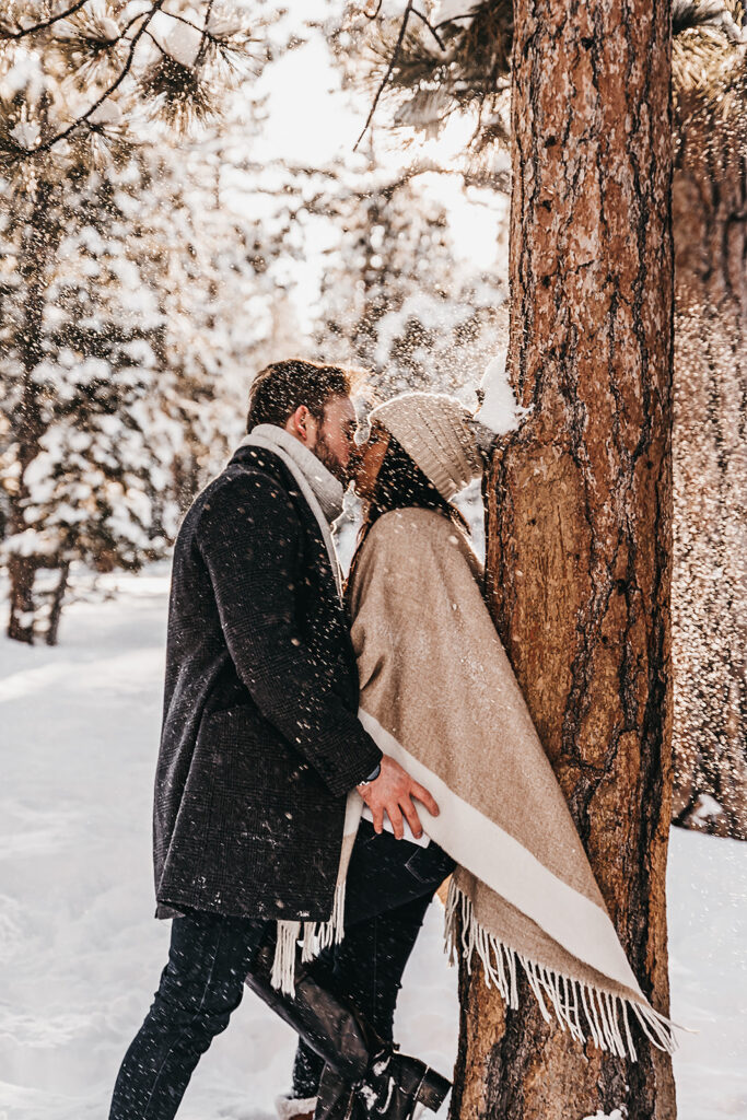 cute picture of the newly engaged couple kissing