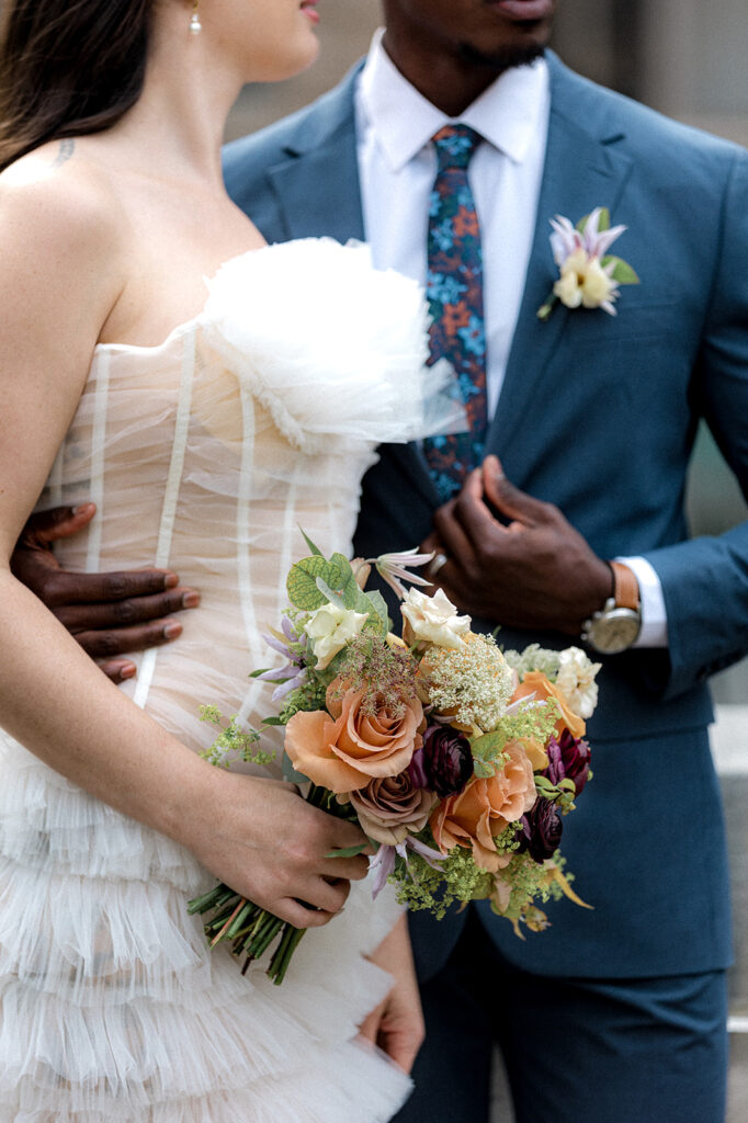 closeup picture of the bride and groom hugging