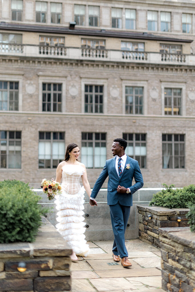 cute couple walking around their stunning wedding venue 