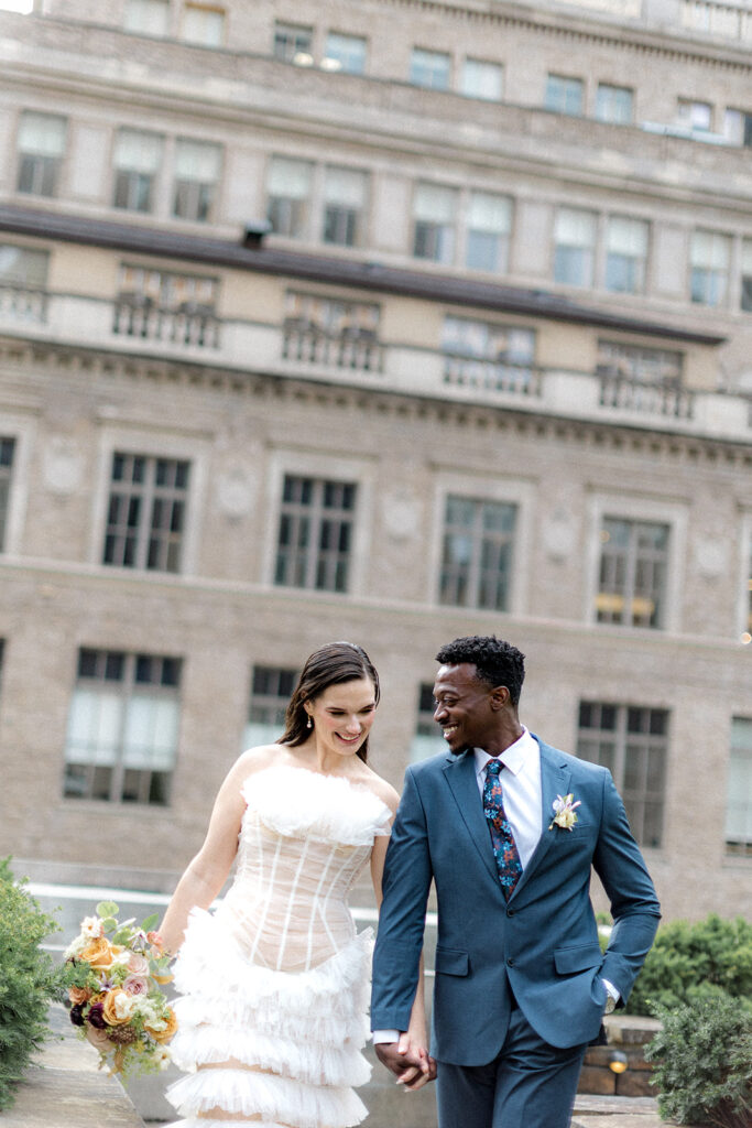 cute couple holding hands before the wedding ceremony 