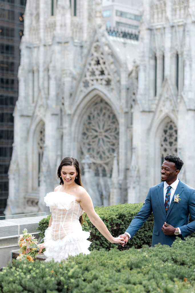 bride and groom holding hands during their bridal portraits