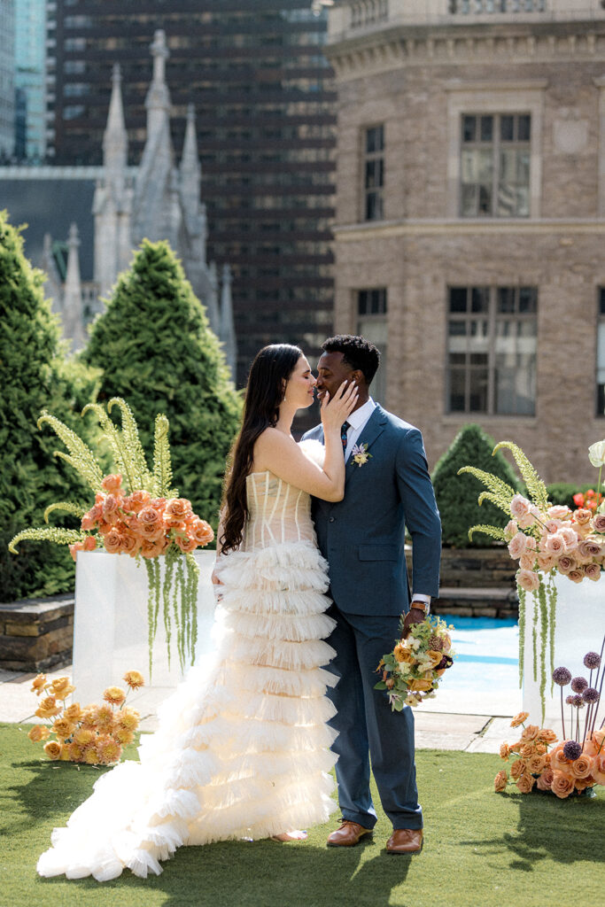 newlyweds kissing during  their photoshoot