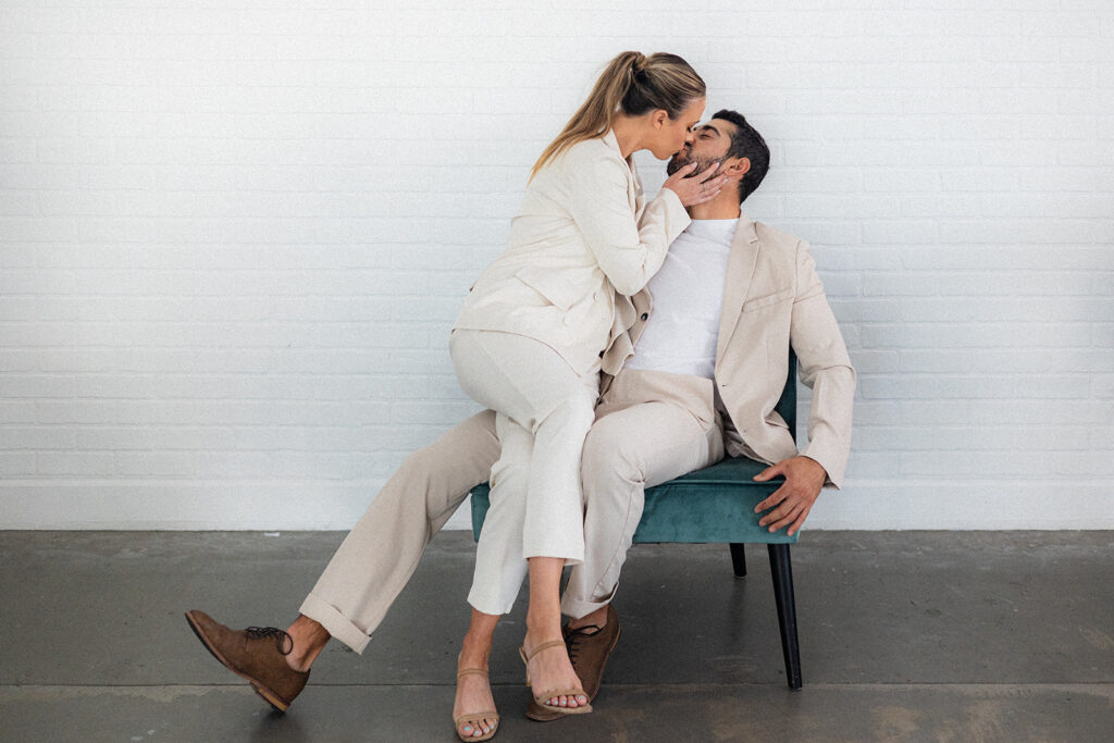 cute picture of the newly engaged couple kissing