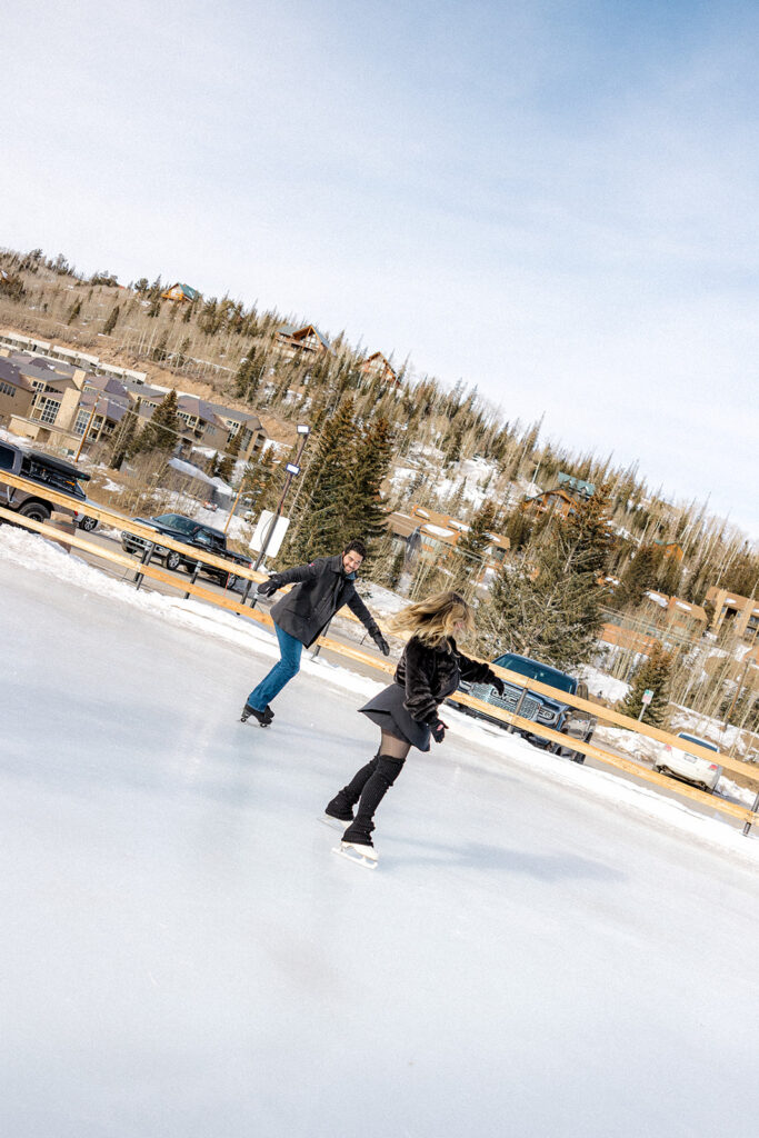 couple ice skating in utah during their photoshoot