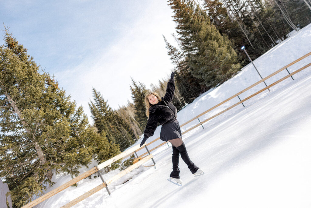 girl having fun ice skating during her photoshoot