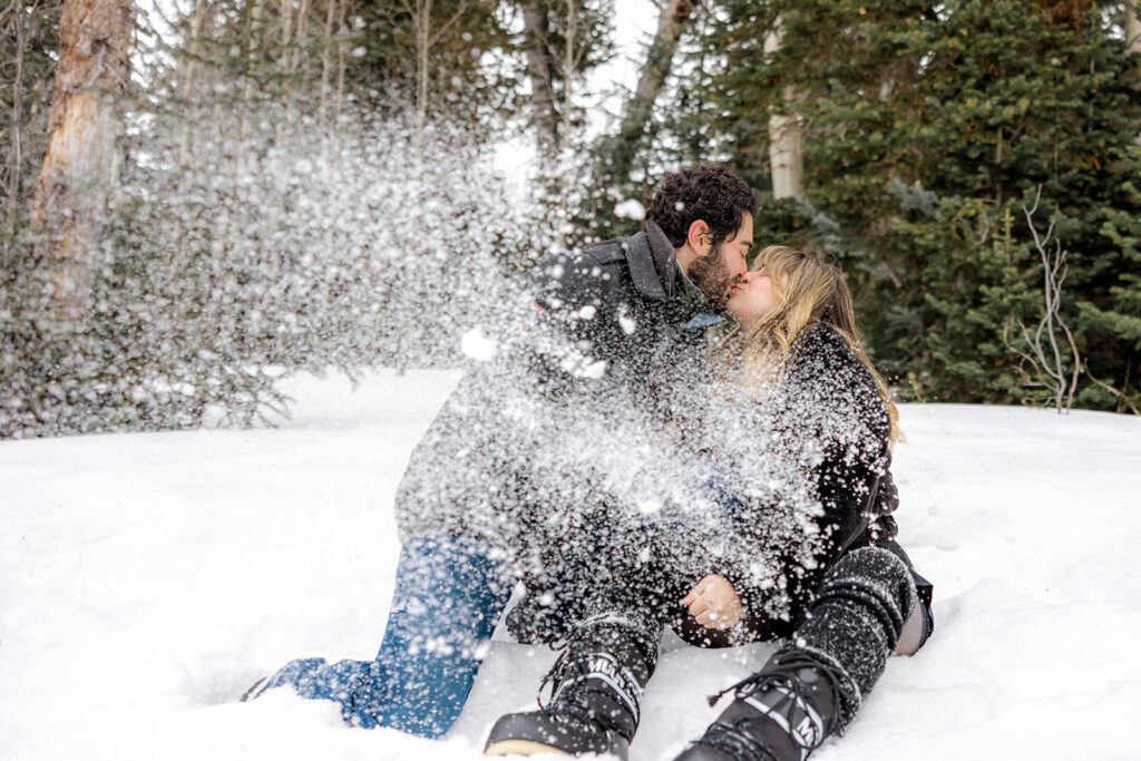 bride and groom kissing during their adventurous and playful session