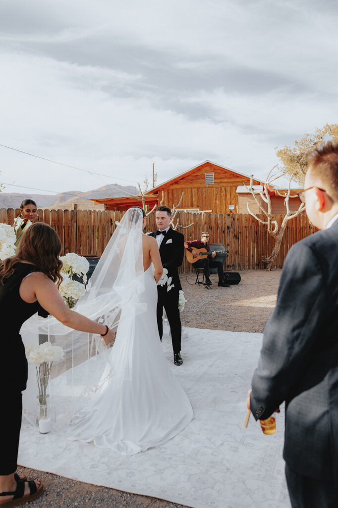Bride and groom holding hands at their wedding ceremony