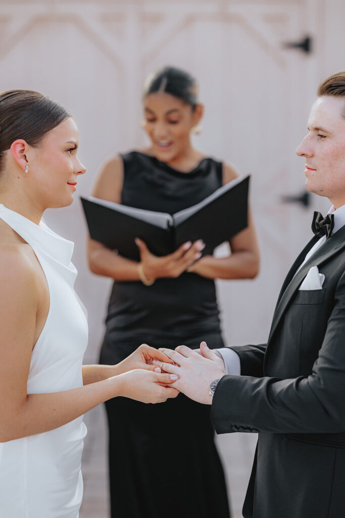 Couple holding hands during the wedding ceremony
