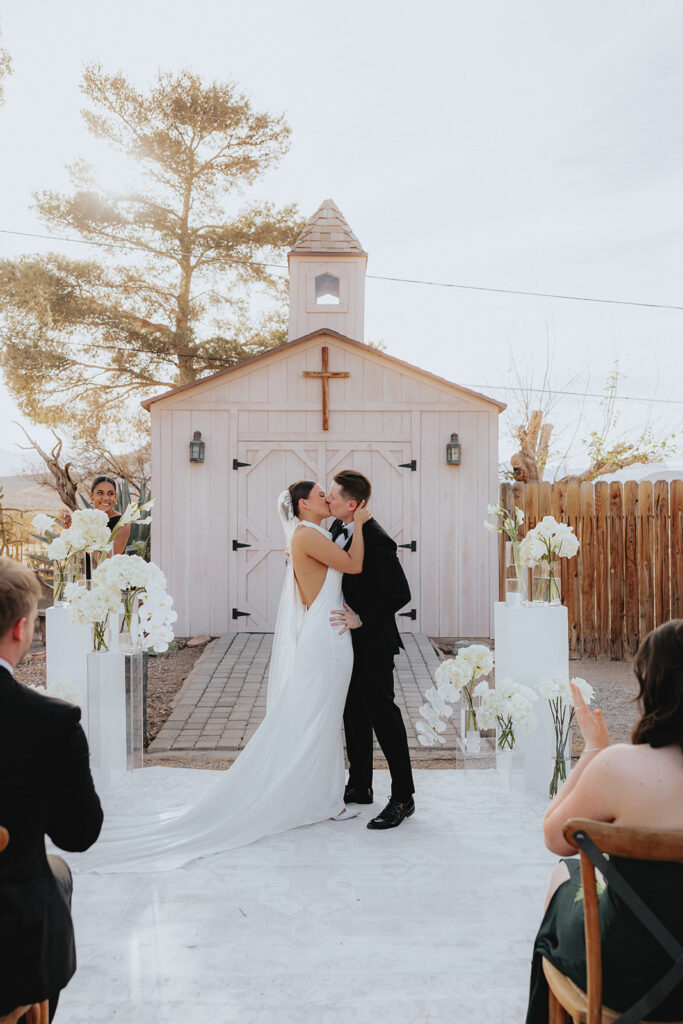 birde and groom, kissing after the ceremony