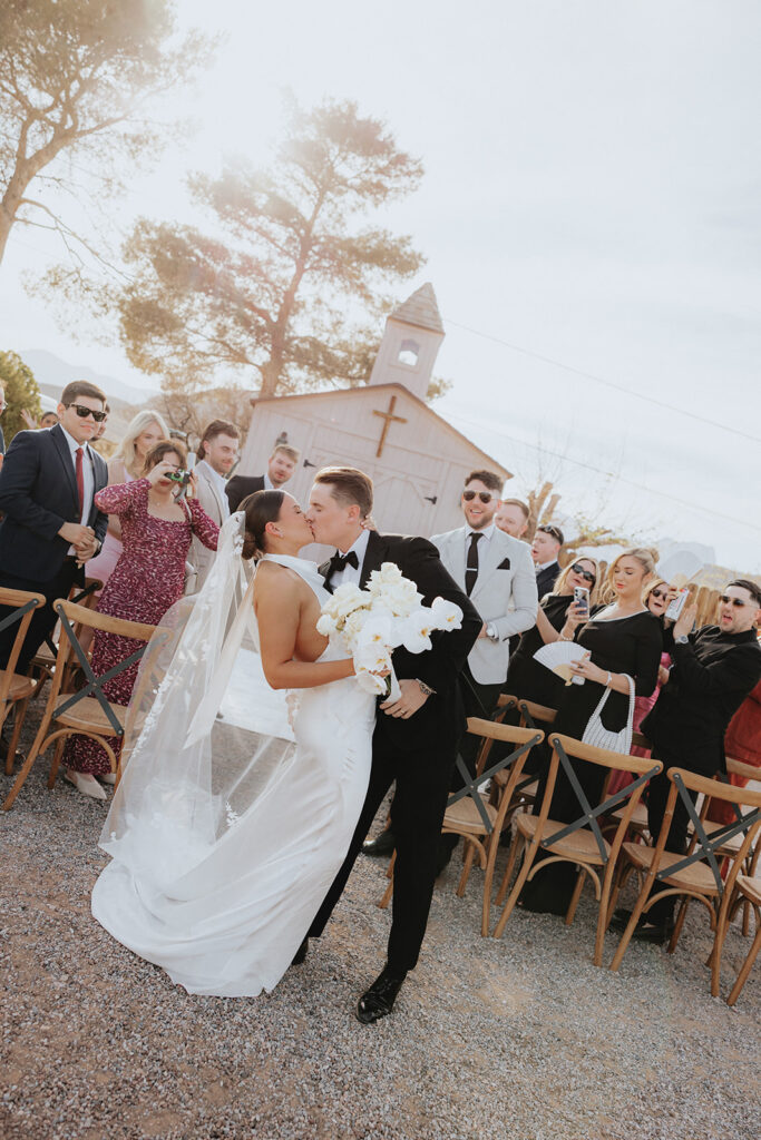 Portrait of the newlyweds kissing
