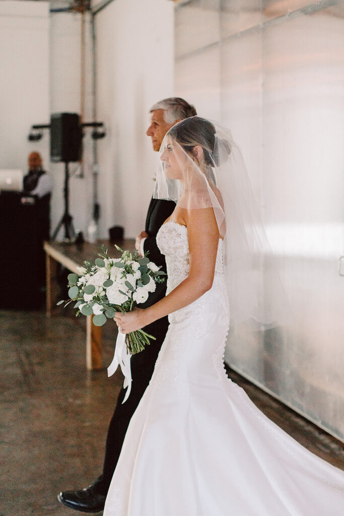 stunning picture of the bride walking down the aisle