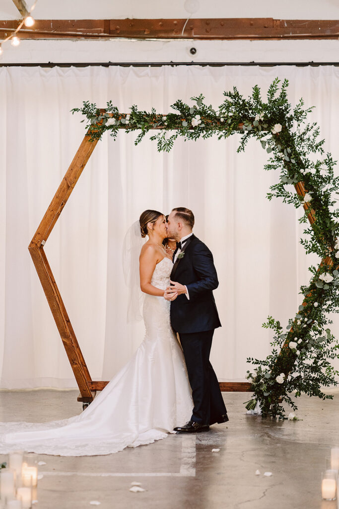 cute couple kissing after their ceremony