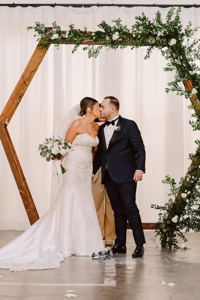 cute picture of the newlyweds kissing