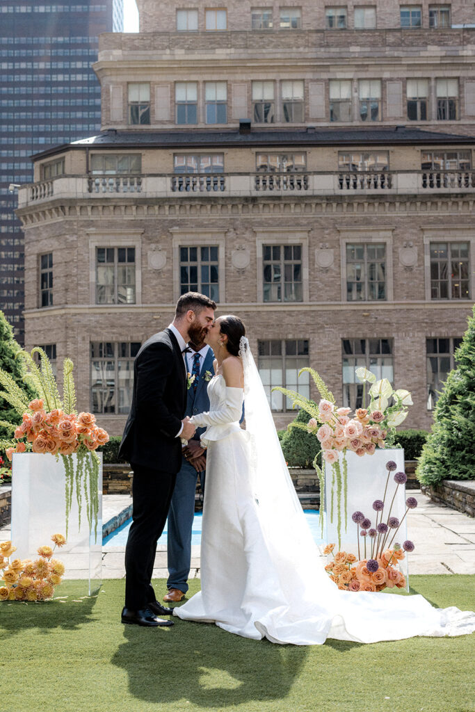 bride and groom kissing after their ceremony