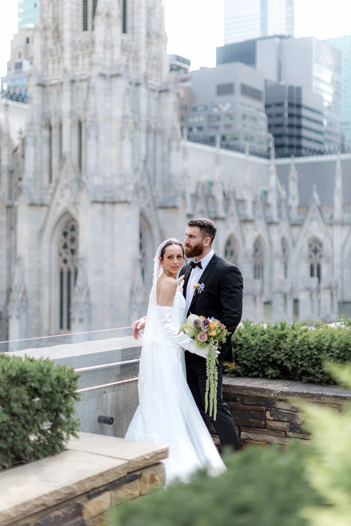 groom kissing the bride on the forehead 