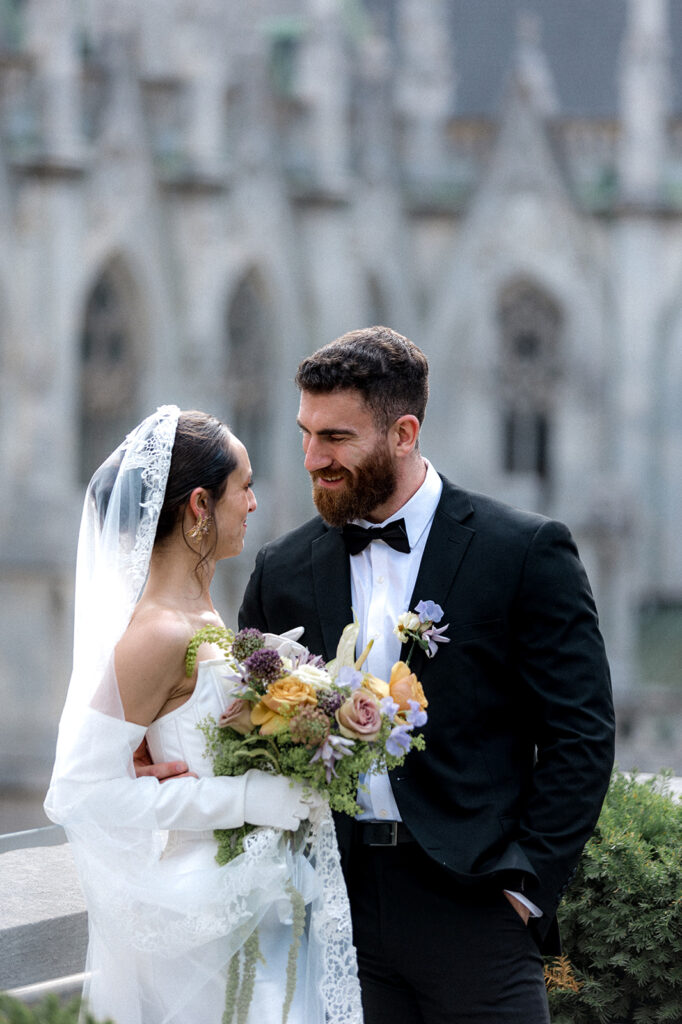 bride and groom laughing with each other during their bridal session