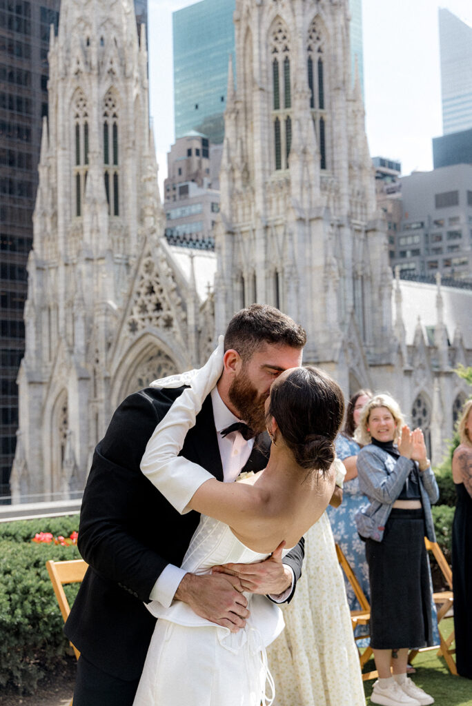 portrait of the newlyweds kissing