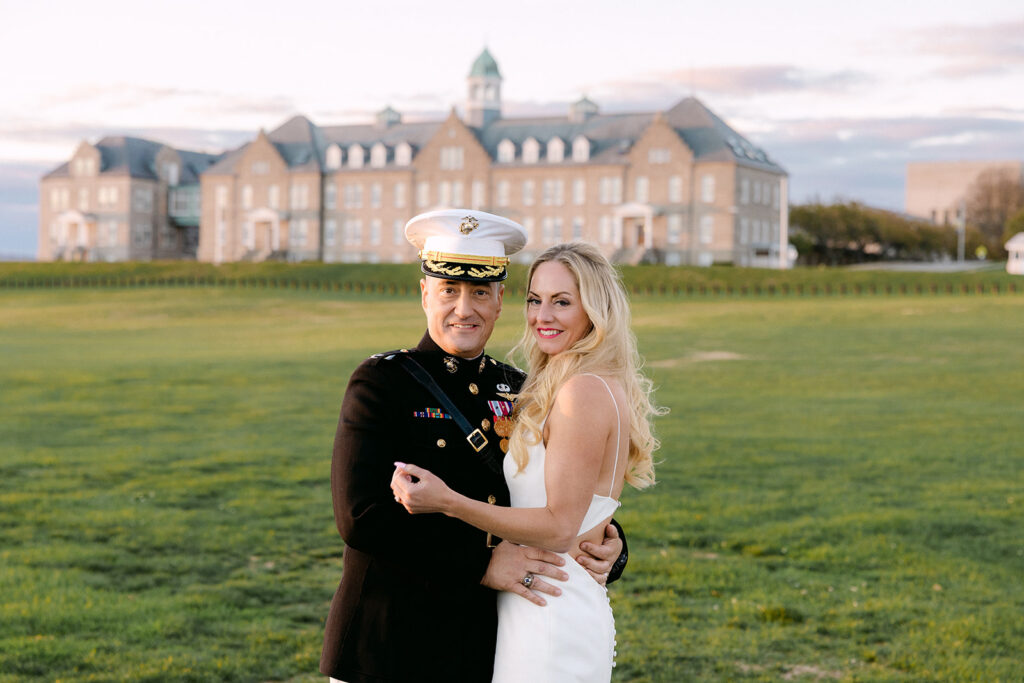 Couple smiling at the camera during golden hour at their Newport Officers' Club Wedding in Newport Rhode Island a coastal wedding celebration